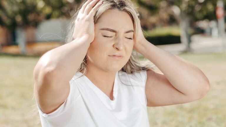 Woman Bracing Against Dizziness